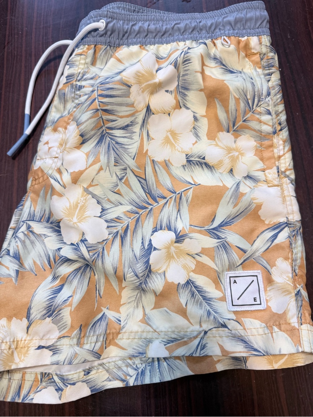 American Eagle Outfitters Men’s Floral Swim Trunks in Tan, Blue, White